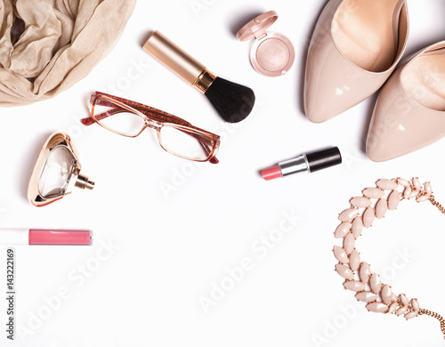 Woman's accessories and cosmetics on the white background