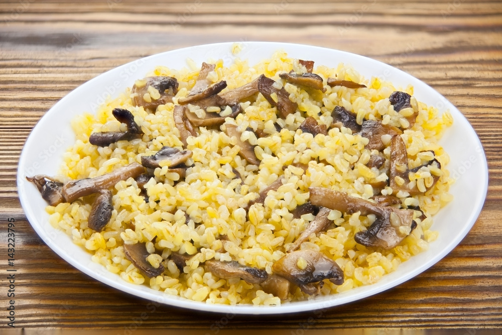 Delicious home made pilaw from wheat on plate Delicious home made pilaw from wheat on plate