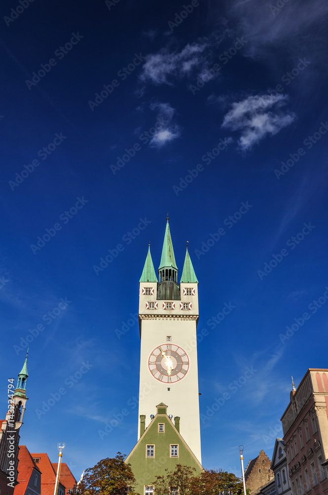 Historic city center of Straubing with old City Tower on a sunny afternoon. Straubing is a city in Lower Bavaria, Bavaria, Germany. The tower, called Stadtturm, is the historic center of the city.