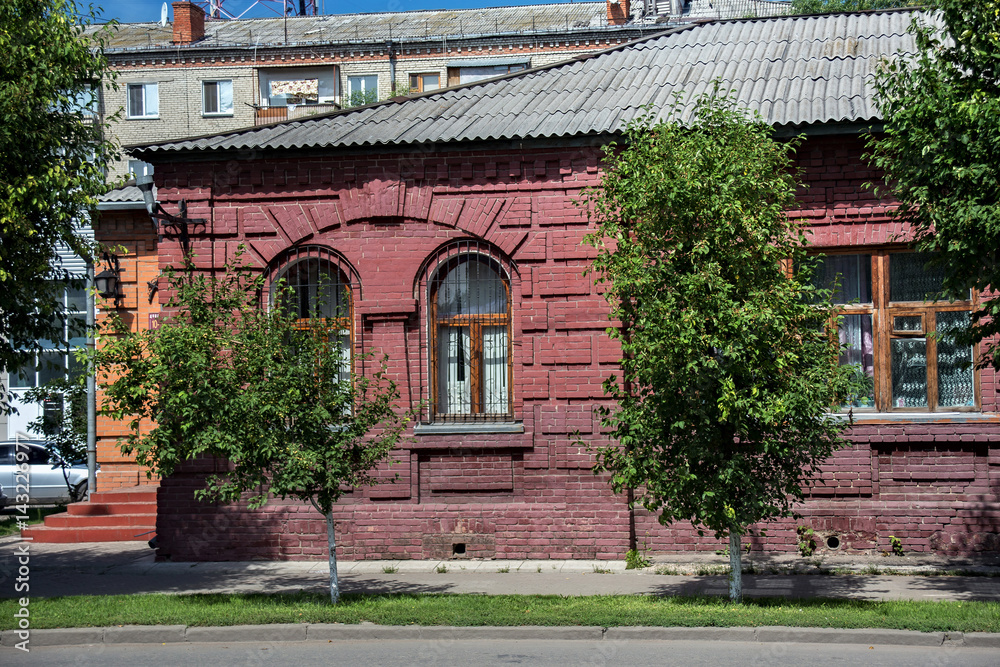 The wall of a typical old historic building (late XIX - early XX century) in the center of the Petropavl, Kazakhstan. Petropavl is a city in northern Kazakhstan close to the border with Russia.