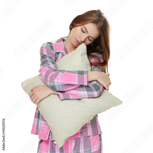 Young sleepy woman with pil...