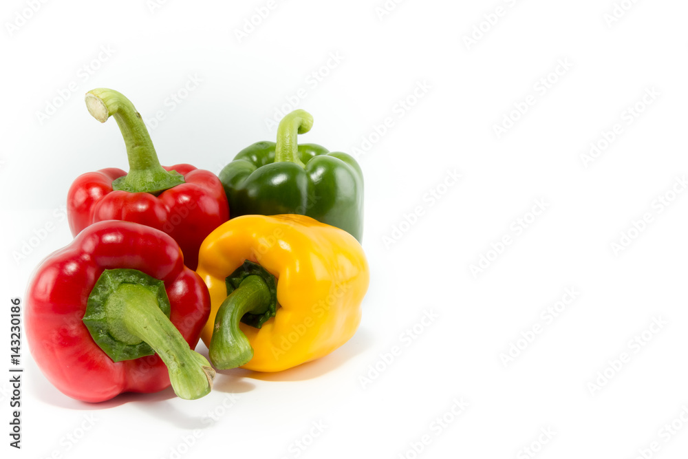 Different colors of fresh bell peppers isolated in white background Different colors of fresh bell peppers isolated in white background
