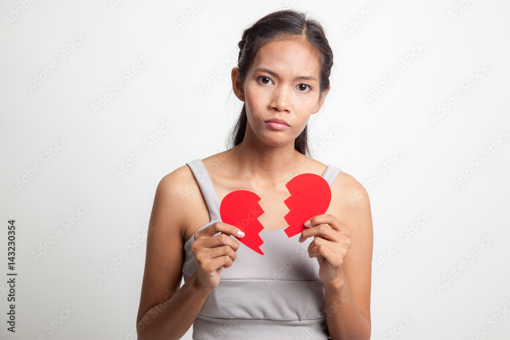 Beautiful young Asian woman with broken heart. Beautiful young Asian woman with broken heart.