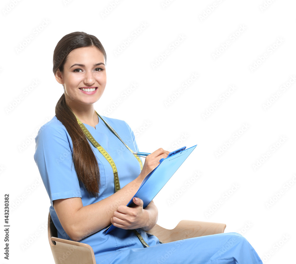 Female nutritionist with clipboard on white background Female nutritionist with clipboard on white background