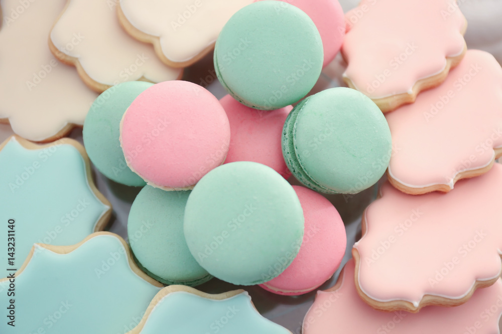Tasty macarons and cookies prepared for party, closeup Tasty macarons and cookies prepared for party, closeup