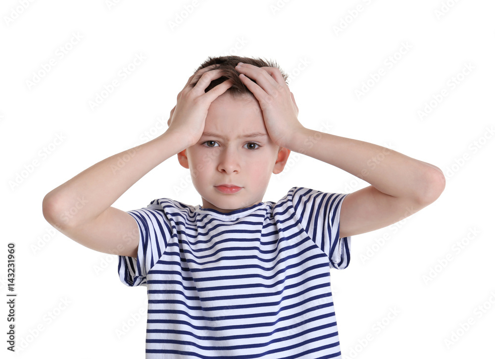 Cute boy suffering from headache on white background Cute boy suffering from headache on white background
