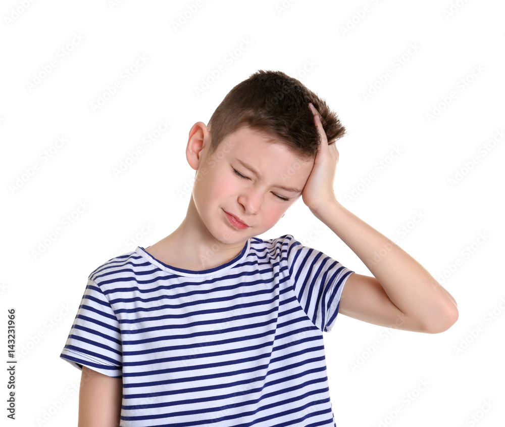 Cute boy suffering from headache on white background Cute boy suffering from headache on white background