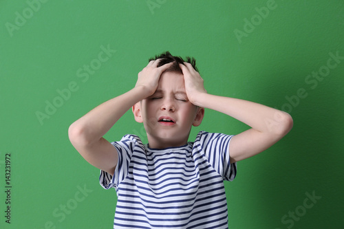 Cute boy suffering from hea...