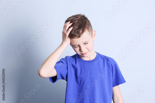 Cute boy suffering from hea...