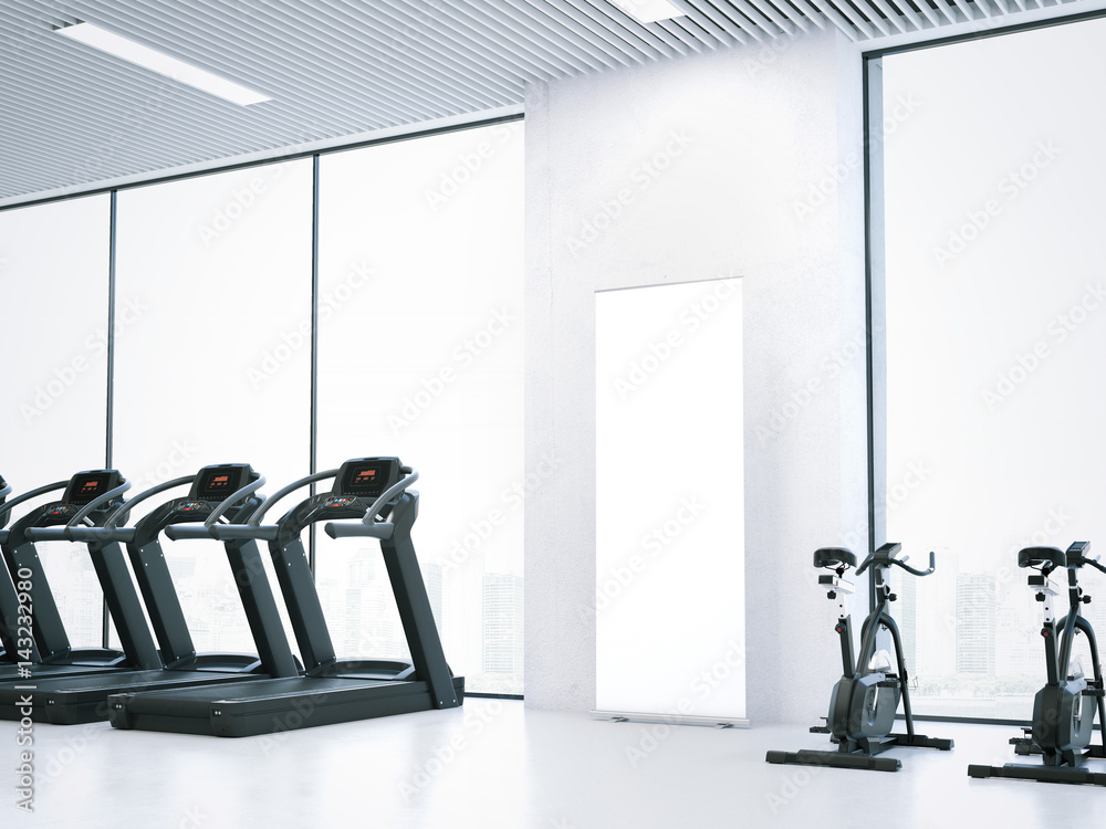 Fototapeta premium Treadmills, bicycle simulators and blank roll-up bunner. 3d rendering