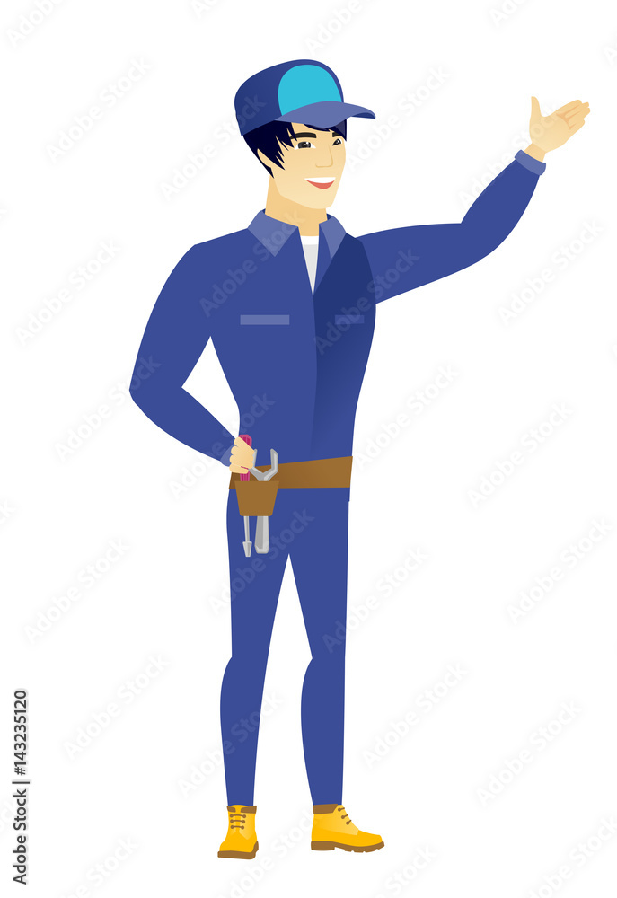 Asian mechanic showing a direction. Asian mechanic showing a direction.
