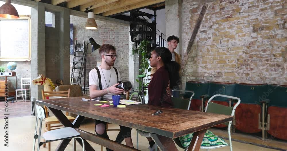 Young entrepreneurs in a meeting discussing VR Young entrepreneurs in a meeting discussing VR