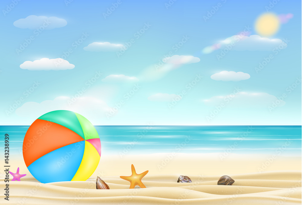 beach ball on a sea sand beach with starfish and shell