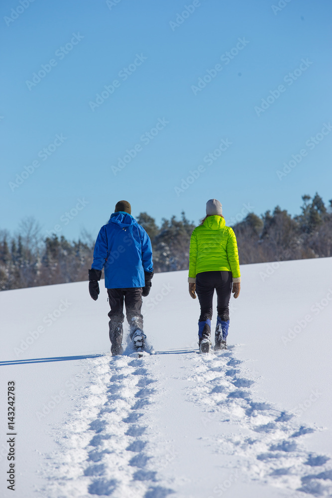 Couple Snowshoeing in fresh snow