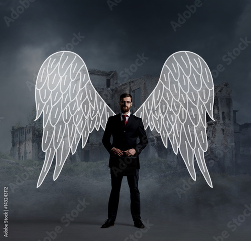 Business angel standing over apocalyptic background. Crisis, default, setback concept. photo