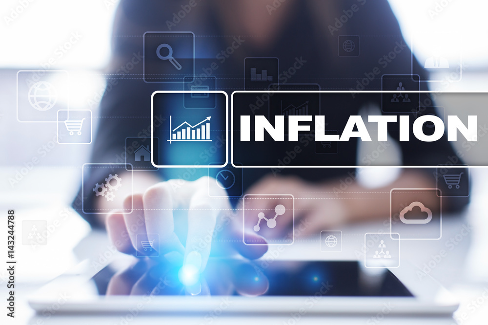 Fototapeta premium Woman using tablet pc, pressing on virtual screen and selecting inflation.