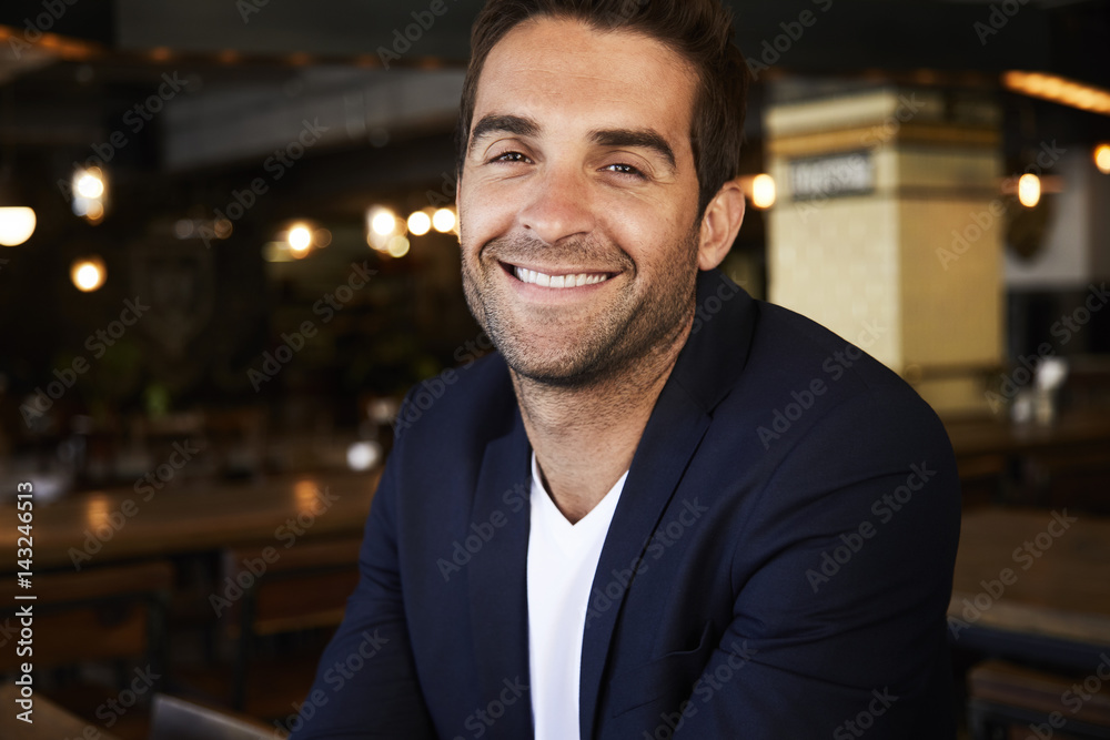 Happy guy smiling in cafe, portrait Happy guy smiling in cafe, portrait