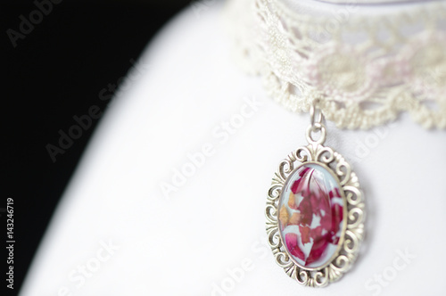 Lace choker with a pendant made of epoxy resin and rose petals