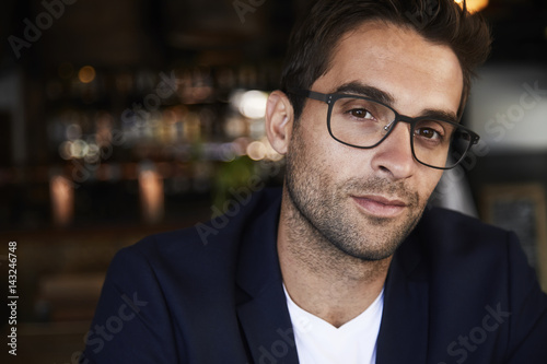 Stubble and glasses buy looking at camera