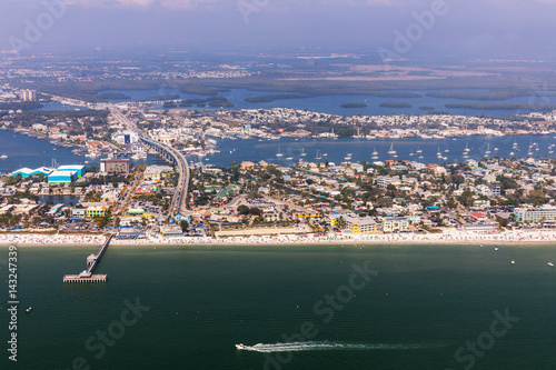 Fishing Pier Fort Myers Beach. Aerial view to the large white sandy beach on the Estero Island, Florida photo