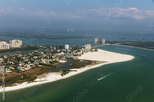Aerial view to the large white sandy beach on the Estero Island, Florida photo