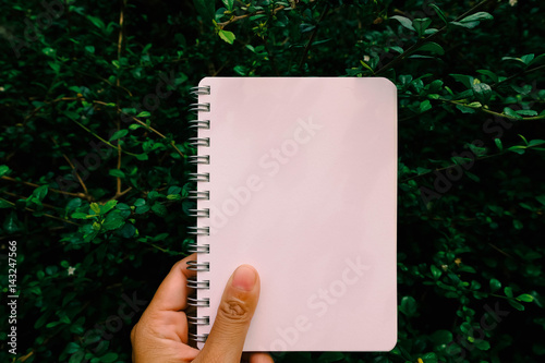 blank notbook with tree background photo