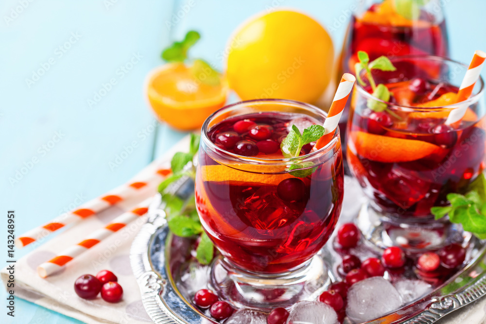Summer drink Sangria with orange and cranberry. Selective focus. Copy space Summer drink Sangria with orange and cranberry. Selective focus. Copy space