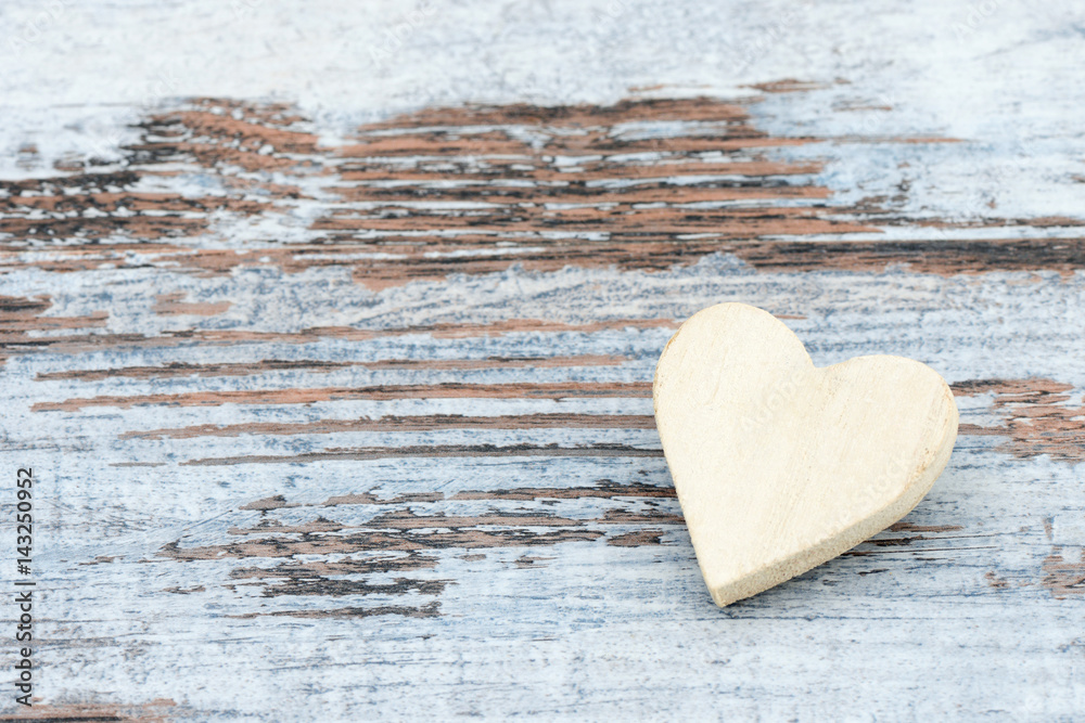 Fototapeta premium heart lying on wood