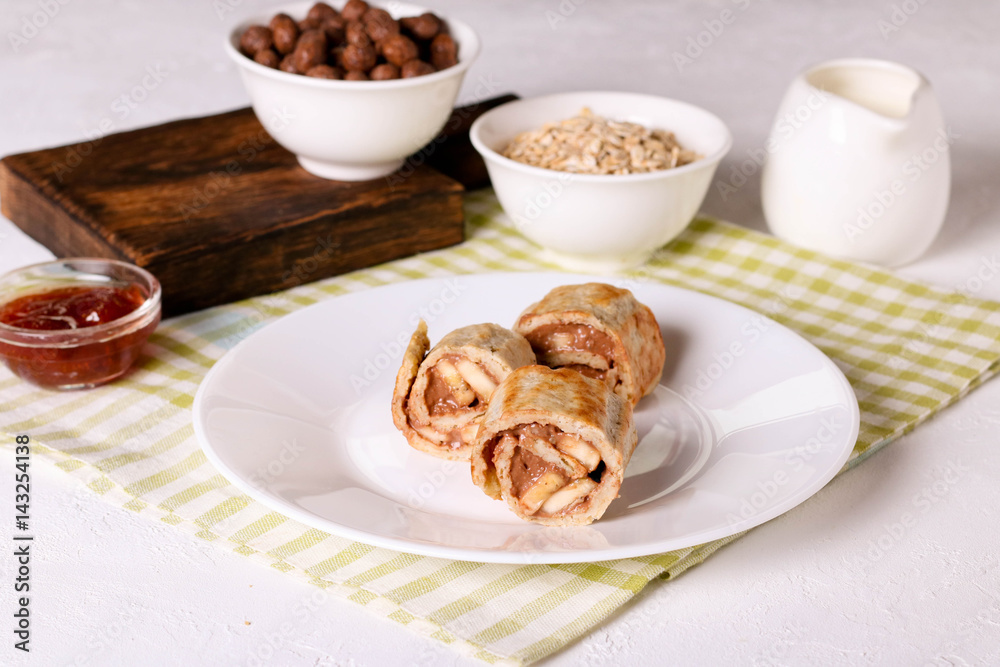 crepes with chocolate filling and banana, horizontal crepes with chocolate filling and banana, horizontal