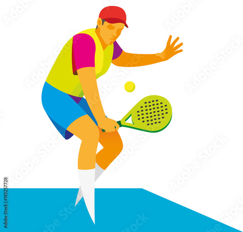 Young padel tennis player takes the ball