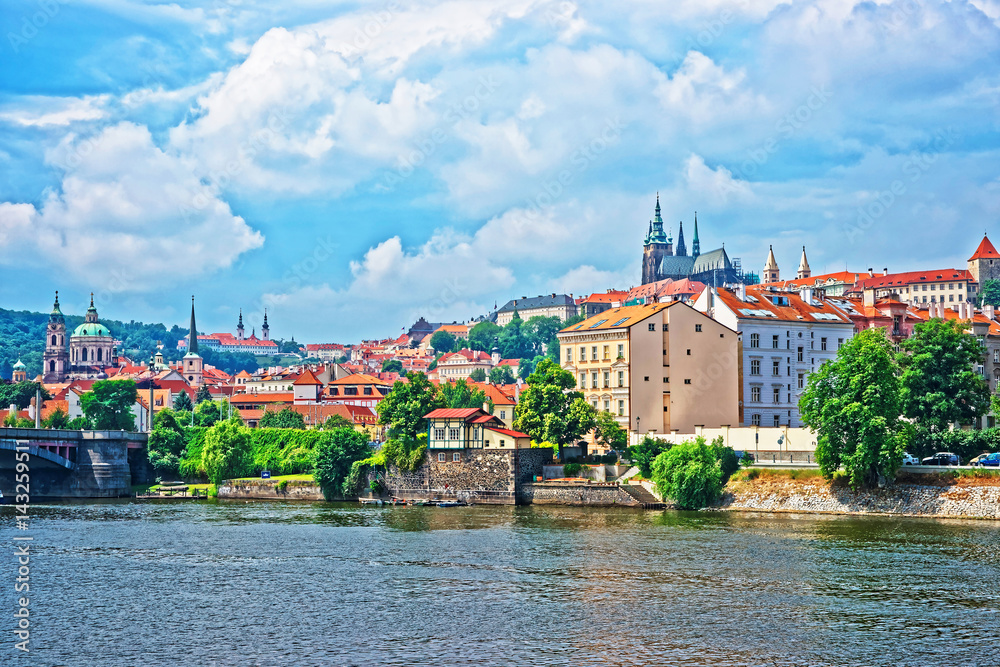 Embankment of Vltava River with Old town in Prague