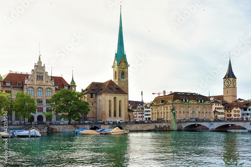 Fraumunster Church and Saint Peter and boats at Limmat Zurich