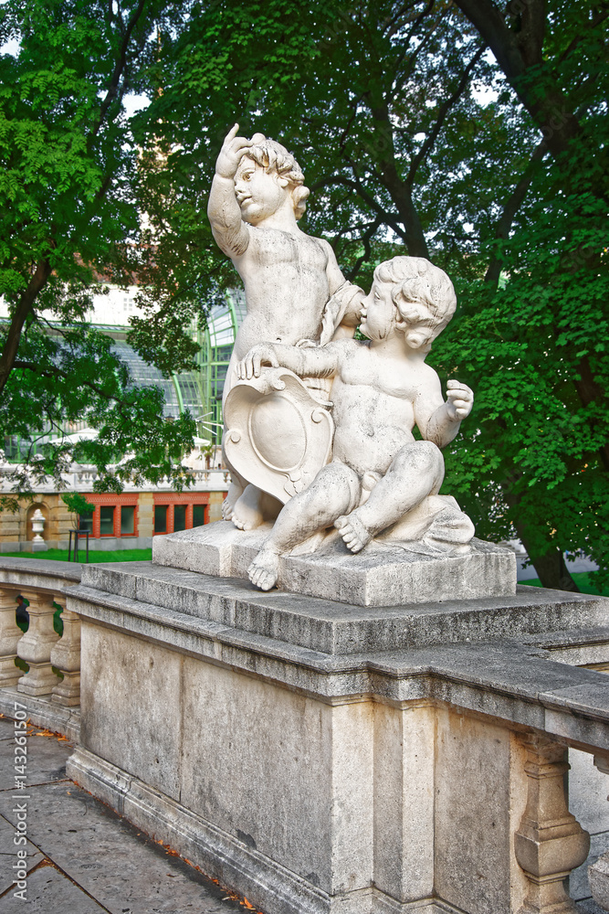 Statue of putti angels in Burggarten in Vienna