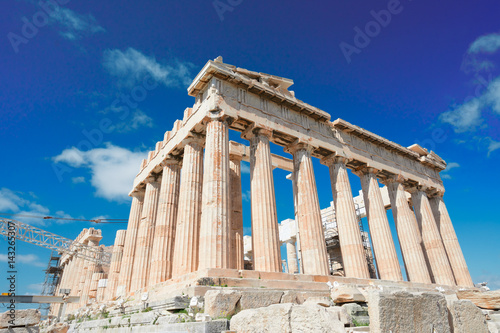 Parthenon temple over bright blue sky background, Acropolis hill, Athens Greece