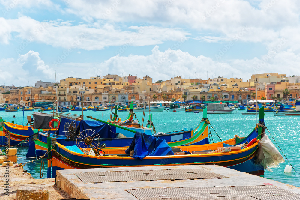 Luzzu colorful boats at Marsaxlokk Bay on Malta