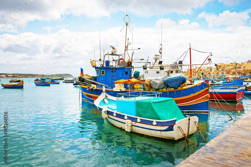 Luzzu colored boats at Marsaxlokk Harbor at Malta