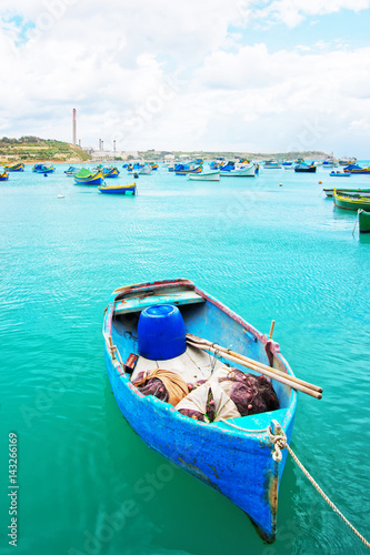 Luzzu colorful boat at Marsaxlokk Harbor in Malta © Roman Babakin