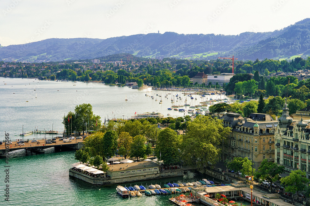 Boats and Quaibrucke at Limmat River in Zurich old town