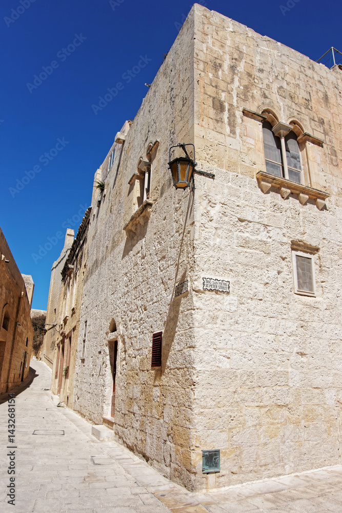 Narrow silent street with lantern in Mdina old town