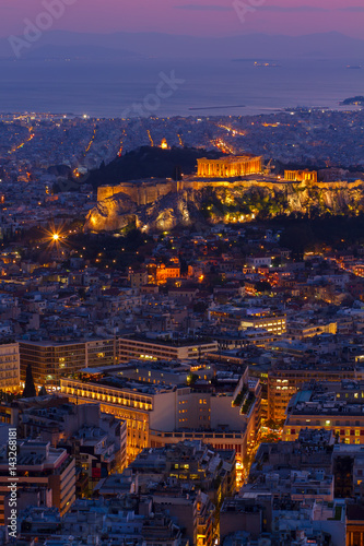 cityscape of Athens with Acropolis hill, Pathenon and sea at night, Greece