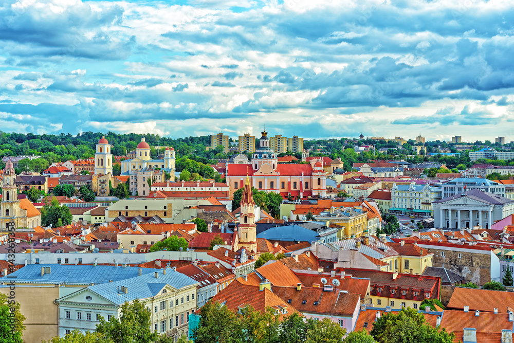Obraz premium Old town in Vilnius with churches steeples and Town Hall