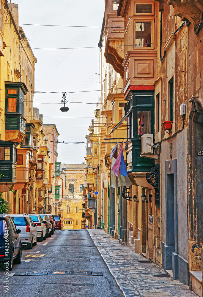 Street with traditional houses at old city center in Valletta
