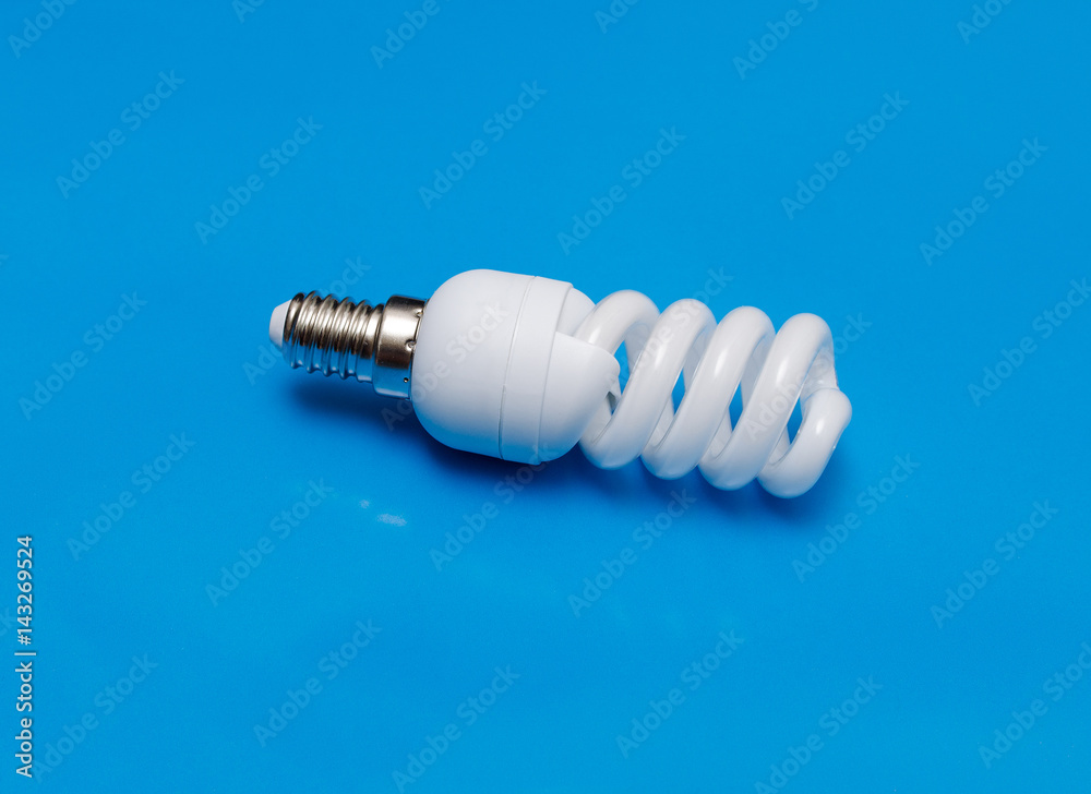 Energy saving lamp on turquoise background. Energy saving lamp on turquoise background.