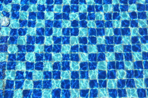 Abstract Blue mosaic tiles of swimming pool water for background