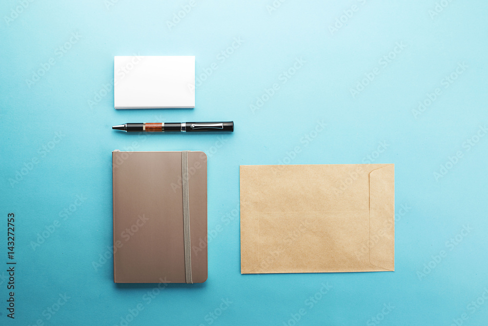 Office supplies on blue background. Envelopes. Mockup. Office supplies on blue background. Envelopes. Mockup.