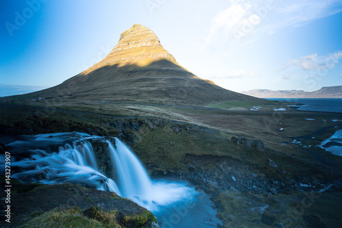 Kirkjufell is a free standing mountain of the Snaefellsnes peninsula, on the northern coast of Iceland. Together seen with the mountain, is a waterfall called Kirkjufellsfoss that flows into the sea.