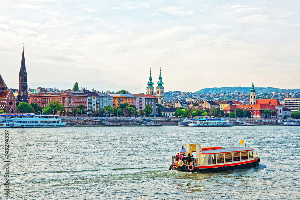 Ferry and Buda City with University Church Steeple at Danube