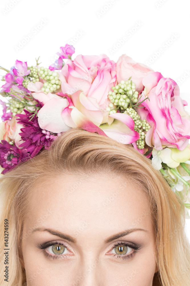 Naklejka premium Flowering beauty. Cropped closeup shot of eyes of a gorgeous woman wearing flower wreath copyspace above isolated on white