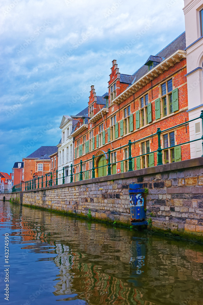 Naklejka premium Guildhalls on Graslei and Korenlei over Lys River Ghent