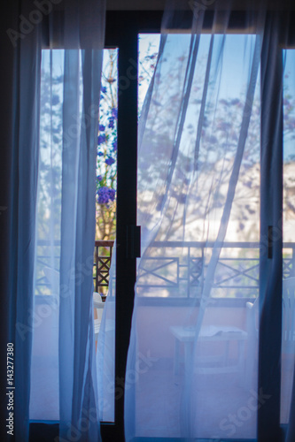 Fotografie Curtains are fluttering in the wind